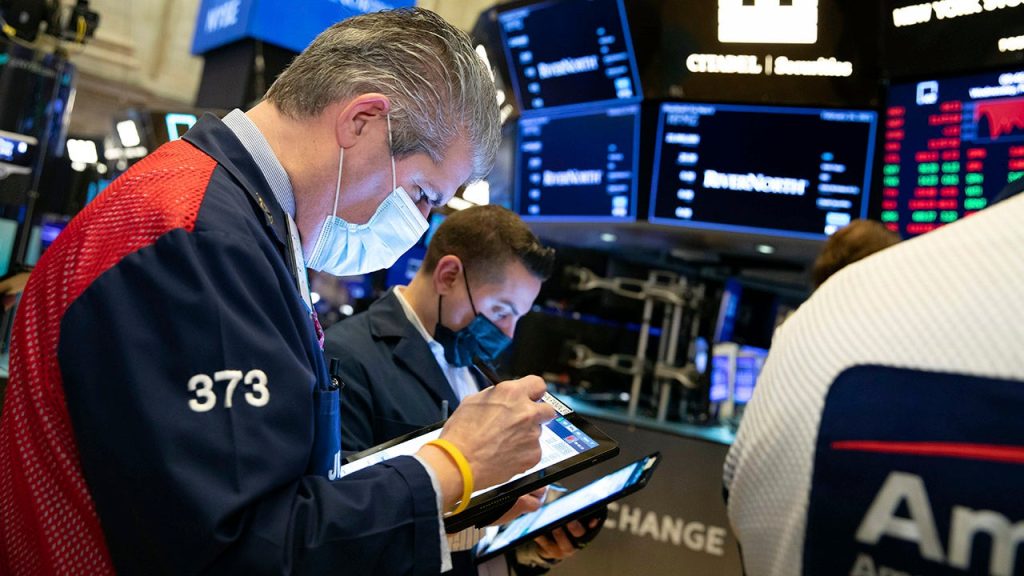 Stocks set for another volatile session, IBM bucks downtrend Financial markets wall street.jpg