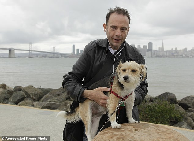 33617980 13648387 Timothy Ray Brown With His Dog Jack On Treasure Island In San Fr A 23 1721320313228.jpg