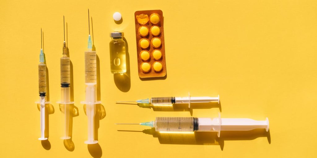 Flat Lay Of Blister Pack Of Pills Placed Near Vials Royalty Free Image 1721314587.jpg