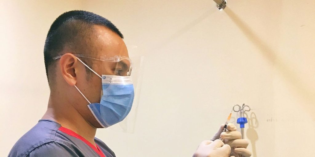 Man In Blue Crew Neck T Shirt Wearing Blue Framed Eyeglasses.jpg
