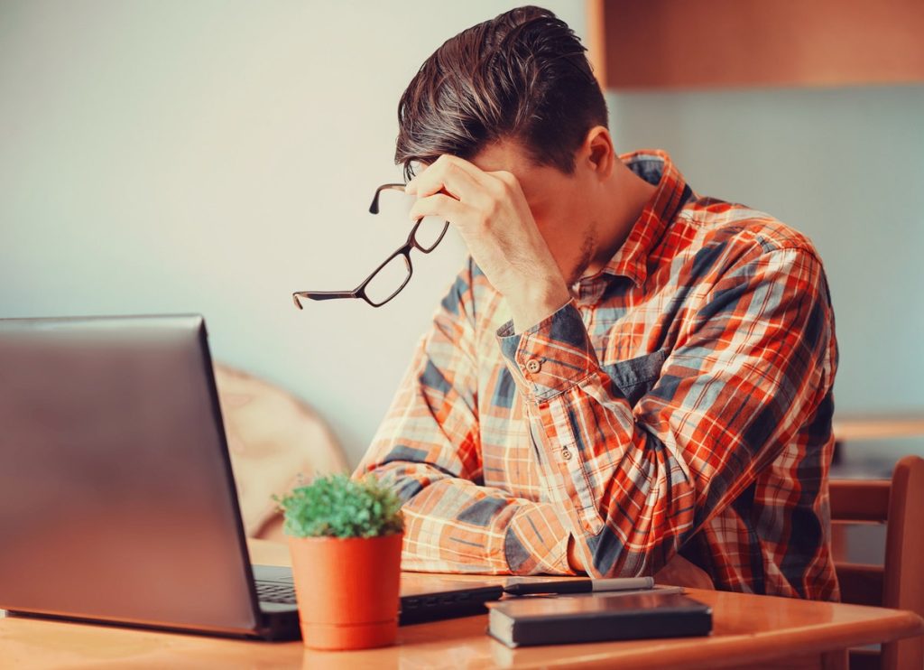 Tired Man At Laptop Istock Medium.jpg