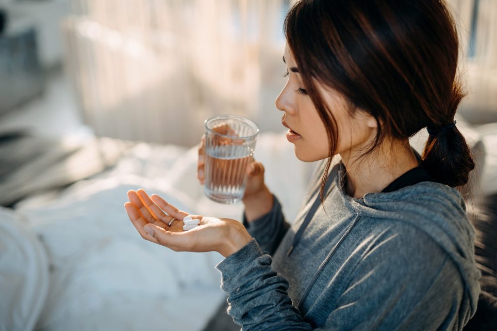 Woman Holding Pills.jpg