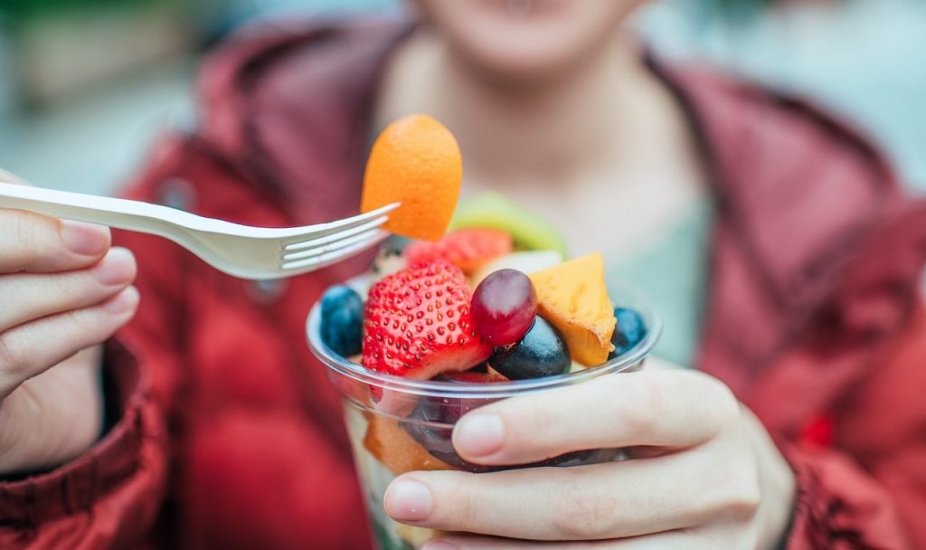 Woman Eating Fruit Cup.jpg