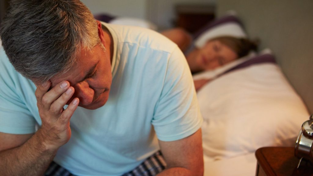 Sleep expert explains why most Americans wake up during the night Man Awake At Night.jpg