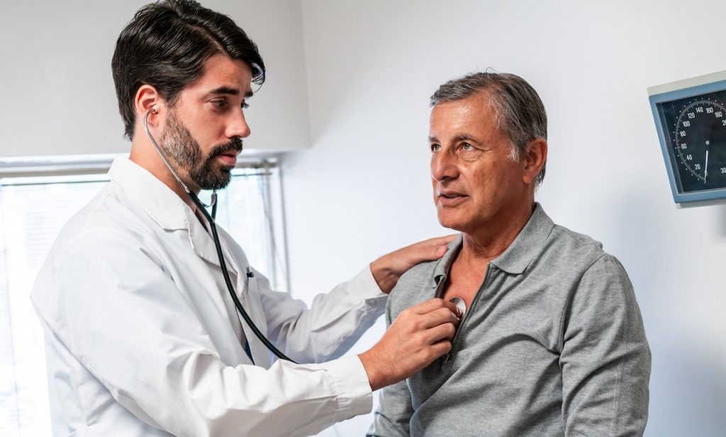 Experimental drug reduces little-known cholesterol that raises heart attack risk Man Heart Doctor.jpg