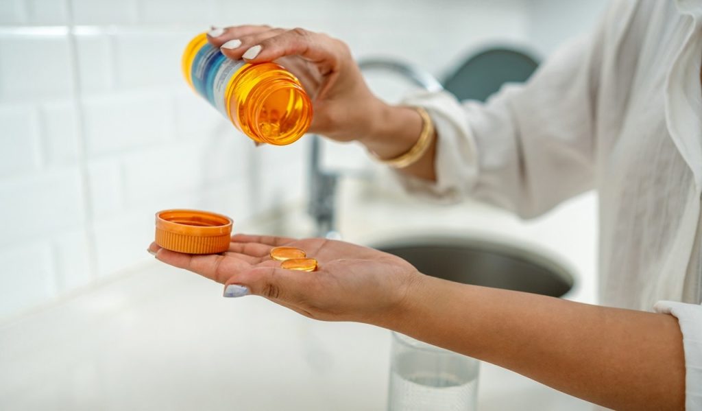 Woman Taking Vitamins.jpg