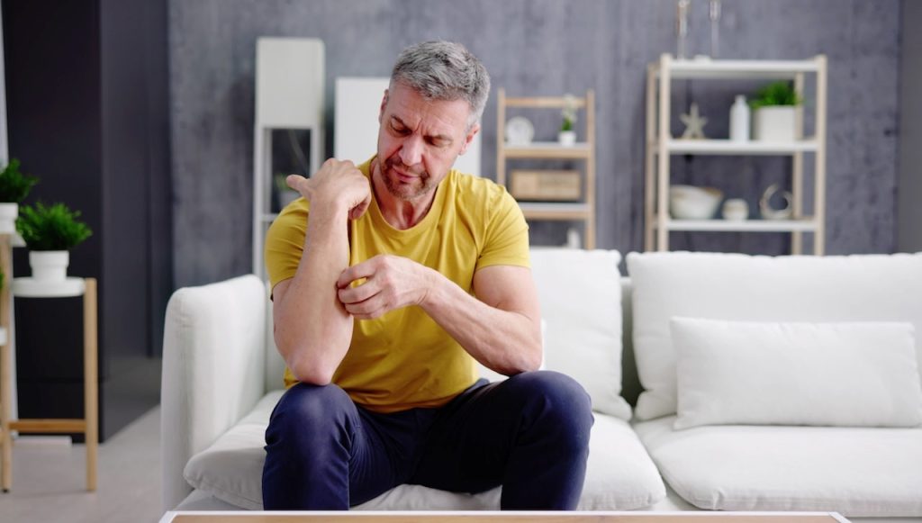 Man Scratching Arm.jpg