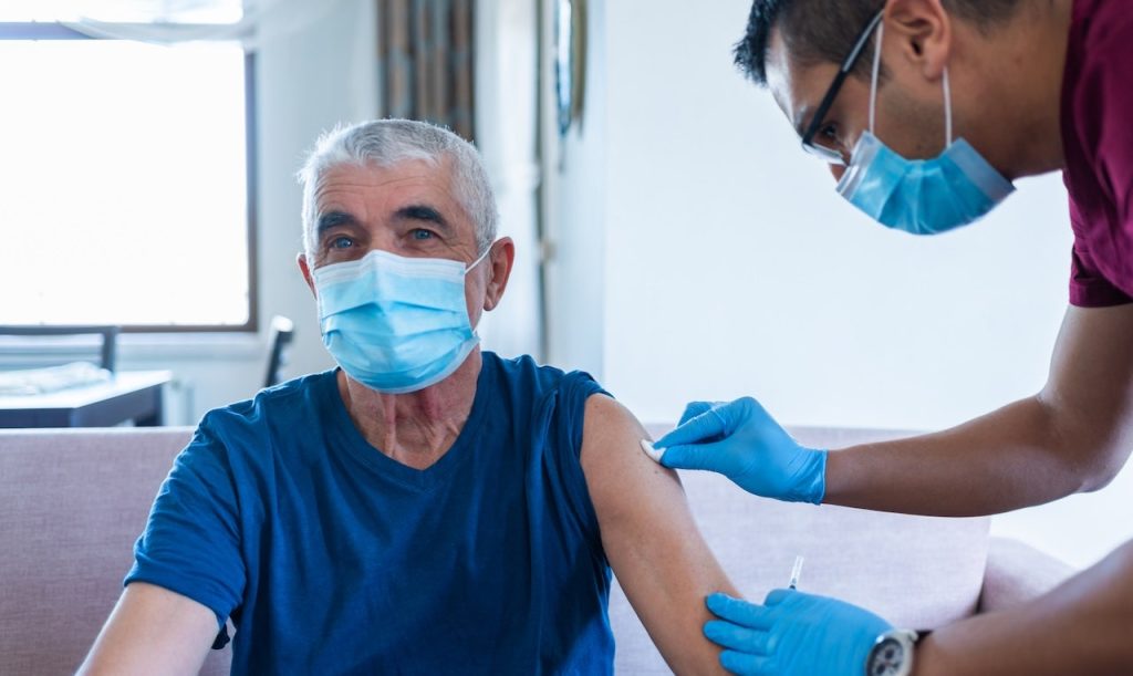 Older Man Getting Vaccine.jpg