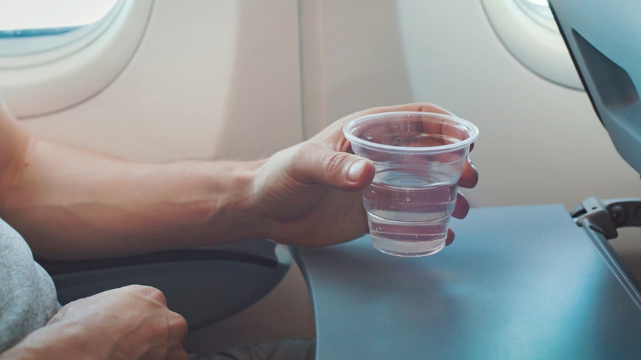 The gross reason airplane passengers might want to avoid using the water on flights Drinking water on plane.jpg