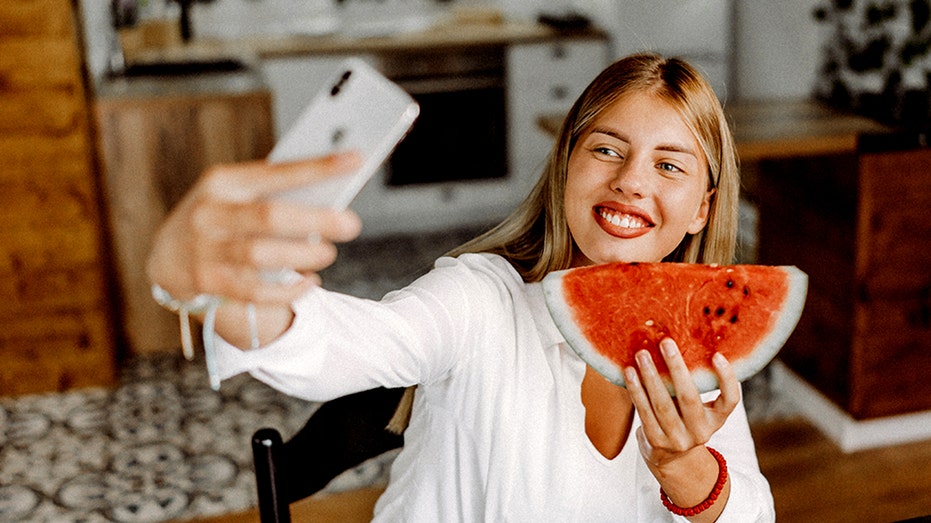The watermelon diet has gone viral — here's what experts say about the weight-loss trend Woman selfie watermelon.jpg