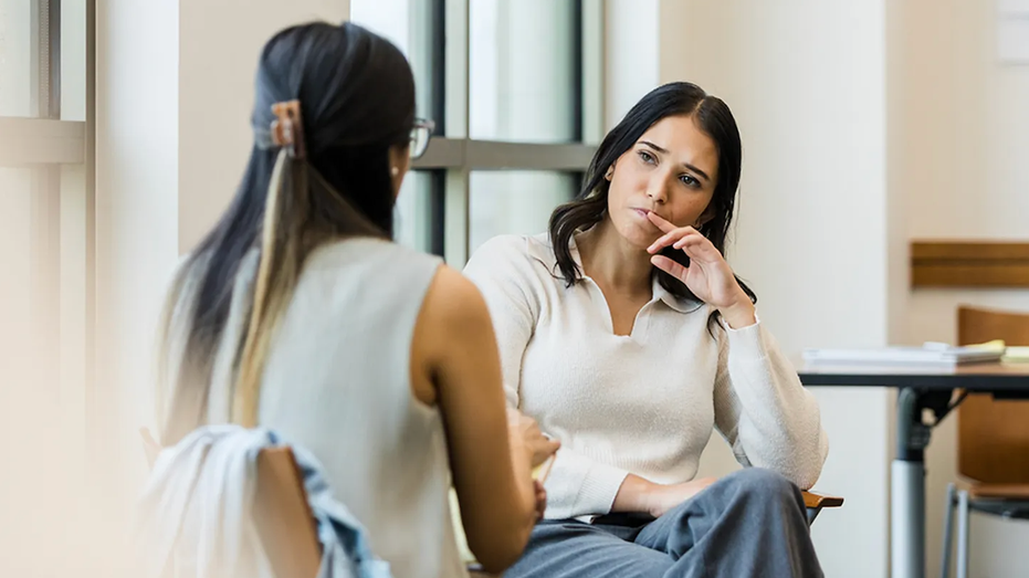 Autism spectrum in adults has commonly overlooked symptoms, experts warn Two women talking therapy autism.png