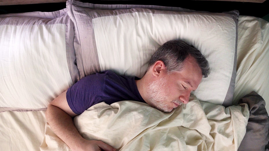 Popular sleep positions could be damaging your nerves, according to experts Man sleeping in bed.jpg
