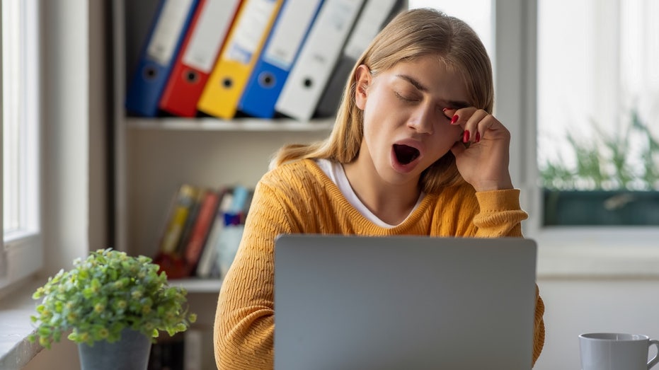 Insufficient sleep linked to major hidden health risk, study reveals Woman tired at work.jpg