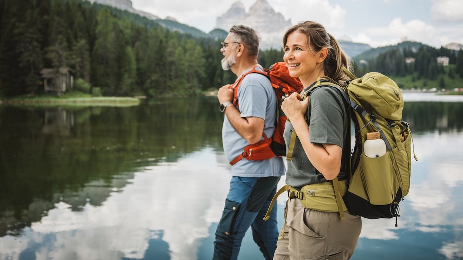 Living at high altitudes could reduce risk of common disease, study suggests Mature couple hiking mountains health.jpg